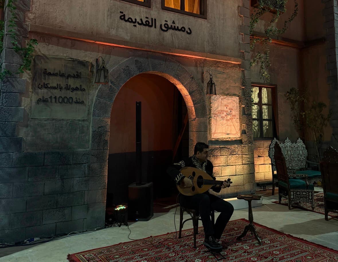 A musician performs in the Old Damascus pavilion at the 63rd Damascus International Fair © Natasha Tarek El-Maissi